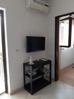 Televízia a/alebo spoločenská miestnosť v ubytovaní Apartment Rakić Pomer