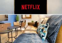 a living room with a couch and a netflix sign at Nestor&amp;Jeeves - DESIGN VIEUX NICE - Old Town - Close sea in Nice
