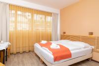Posteľ alebo postele v izbe v ubytovaní Apartments Favoriten