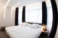 Cama o camas de una habitación en Hotel Lux Santiago
