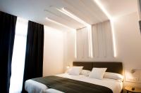 Cama o camas de una habitación en Hotel Lux Santiago