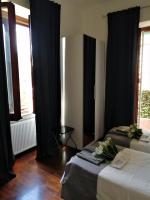 A bed or beds in a room at EMI's Guest House