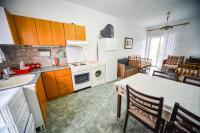 Kuchyňa alebo kuchynka v ubytovaní Apartman Porto Blue Lux