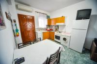 Kuchyňa alebo kuchynka v ubytovaní Apartman Porto Blue Lux