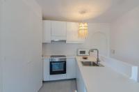 Kuchyň nebo kuchyňský kout v ubytování Apartamento holidays