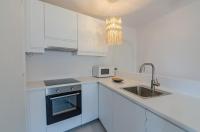 Kuchyň nebo kuchyňský kout v ubytování Apartamento holidays
