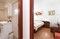 Łóżko lub łóżka w pokoju w obiekcie Apartmani PARADISO