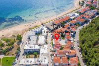 an aerial view of a resort on a beach at Crist Luxury Apartments in Nea Potidaea