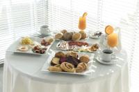 una mesa con tres platos de bollería. en Glaros Royal Beach Hotel, en Hersonissos