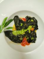 a white plate of food with vegetables on it at Garda Relais Antica Romelia in Montichiari