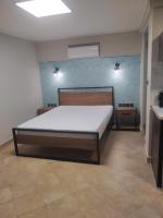 Posteľ alebo postele v izbe v ubytovaní Elaėa Boutique Apartments