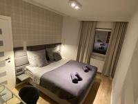 Posteľ alebo postele v izbe v ubytovaní Apartament Opieszyn 16