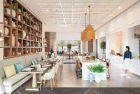 a rendering of a restaurant with tables and chairs at Address Beach Resort Fujairah in Al Aqah