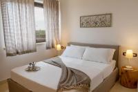 A bed or beds in a room at TERRA TERRA - Masseria Minunni