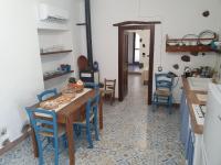 A kitchen or kitchenette at Casa Vacanza Sa Prenda