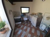 A kitchen or kitchenette at Casa Vacanza Sa Prenda