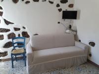 A television and/or entertainment centre at Casa Vacanza Sa Prenda