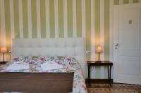 A bed or beds in a room at Amar