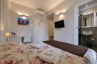 A bed or beds in a room at Amar
