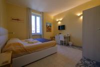 A bed or beds in a room at Amar