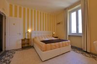 A bed or beds in a room at Amar