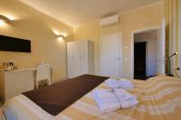 A bed or beds in a room at Amar
