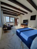 A television and/or entertainment centre at Palazzo del Golfo Penthouse