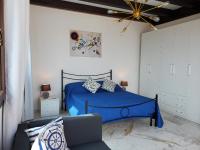 A bed or beds in a room at Palazzo del Golfo Penthouse