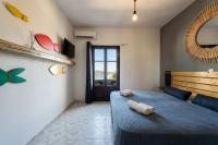 Postel nebo postele na pokoji v ubytování Ragoussis Sweet Rooms