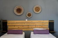 Postel nebo postele na pokoji v ubytování Ragoussis Sweet Rooms
