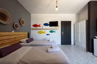 Postel nebo postele na pokoji v ubytování Ragoussis Sweet Rooms