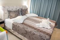 Postel nebo postele na pokoji v ubytování Glyfada Beach Hotel