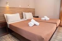 Posteľ alebo postele v izbe v ubytovaní Tereza's Sunset Hotel