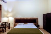 Hotel Mahkota Plengkung by ecommercelokaにあるベッド