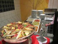 a large pizza on a table in a kitchen at Calimbra Wellness Hotel Superior in Miskolctapolca