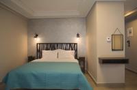 Posteľ alebo postele v izbe v ubytovaní Elaėa Boutique Apartments