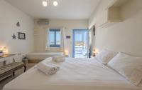 Posteľ alebo postele v izbe v ubytovaní Blu Suites and Studios