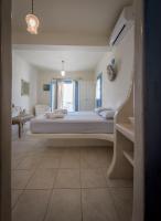 Posteľ alebo postele v izbe v ubytovaní Blu Suites and Studios