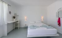 Posteľ alebo postele v izbe v ubytovaní Blu Suites and Studios