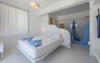 Posteľ alebo postele v izbe v ubytovaní Blu Suites and Studios