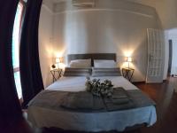 A bed or beds in a room at EMI's Guest House