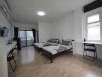 Postel nebo postele na pokoji v ubytování Prukpibul Apartment