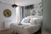 Łóżko lub łóżka w pokoju w obiekcie Bilbao Art Lodge Staynnapartments