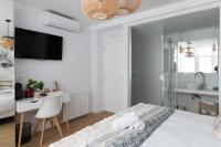Łóżko lub łóżka w pokoju w obiekcie Bilbao Art Lodge Staynnapartments