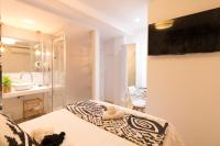 Łóżko lub łóżka w pokoju w obiekcie Bilbao Art Lodge Staynnapartments