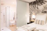Łóżko lub łóżka w pokoju w obiekcie Bilbao Art Lodge Staynnapartments