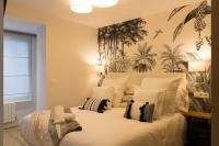 Łóżko lub łóżka w pokoju w obiekcie Bilbao Art Lodge Staynnapartments