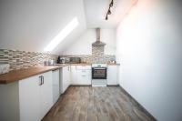 Kuchnia lub aneks kuchenny w obiekcie Pataky Apartmanok