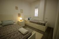 Posteľ alebo postele v izbe v ubytovaní Livingtarifa Apartamento Coco