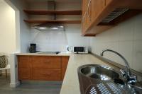 Kuchyňa alebo kuchynka v ubytovaní Livingtarifa Apartamento Coco
